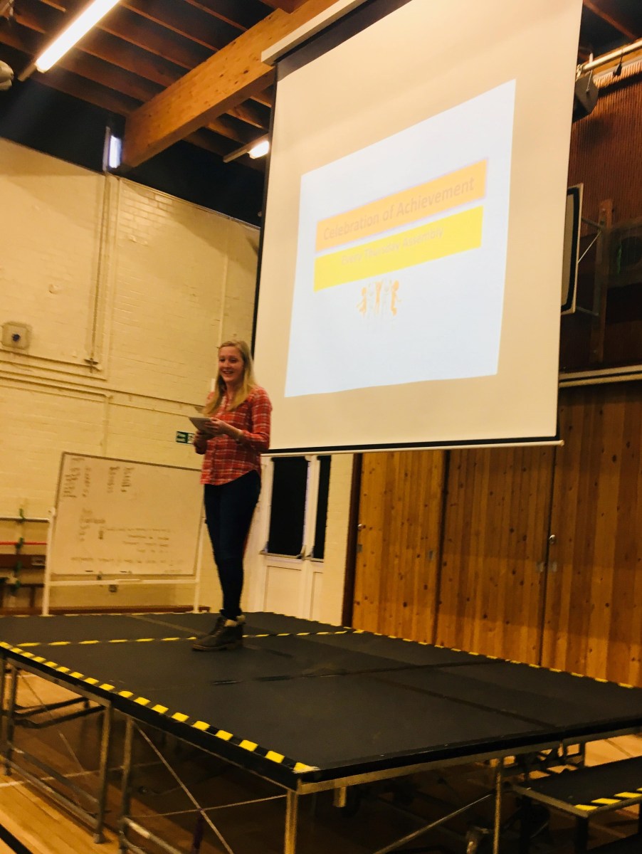 Deafie Blogger on stage giving a Speech at Oak Lodge School